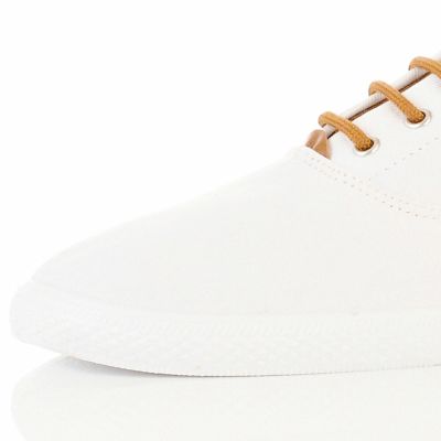 White and tan contrast plimsolls