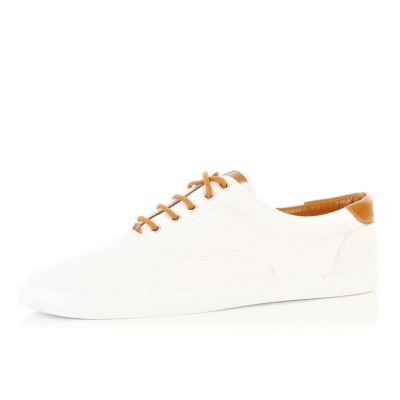 White and tan contrast plimsolls