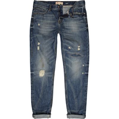 Mid wash distressed Flynn skinny jeans