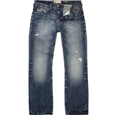 Mid wash distressed Clint bootcut jeans
