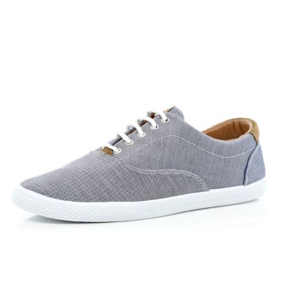 Blue canvas lace up trainers