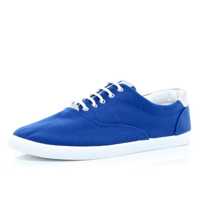 Blue canvas lace up plimsolls