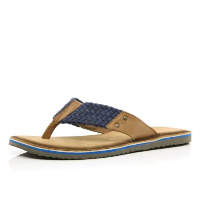 Blue and tan plaited flip flops