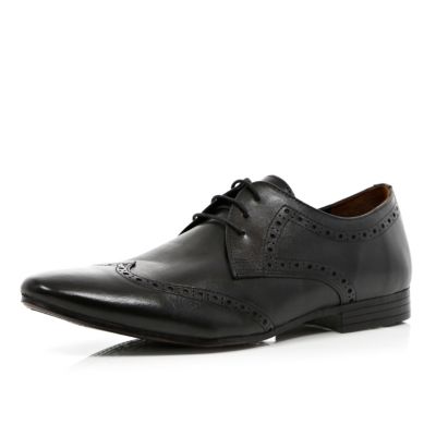 Black pointed brogues