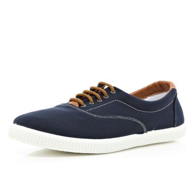 Navy lace up plimsolls