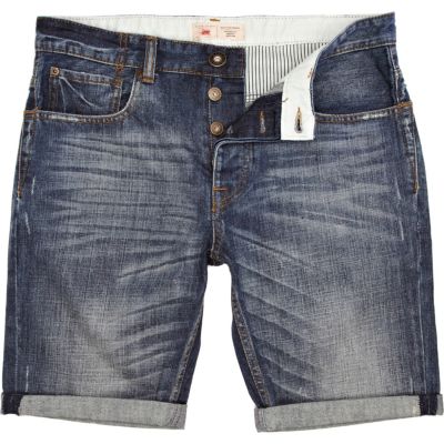Mid wash distressed turn up denim shorts