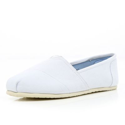 White slip on plimsolls