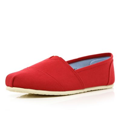 Red slip on plimsolls
