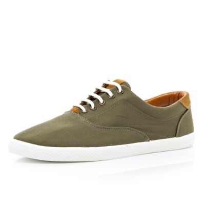 Green canvas lace up trainers
