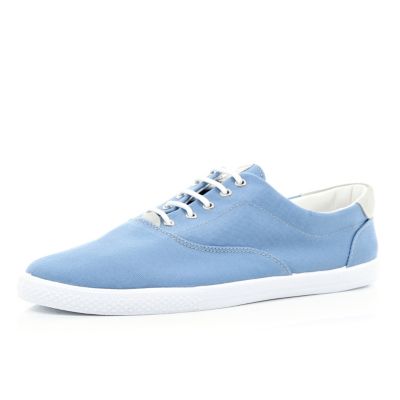 Blue lace up plimsolls