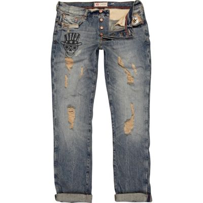 Mid wash ripped skull Dylan slim jeans
