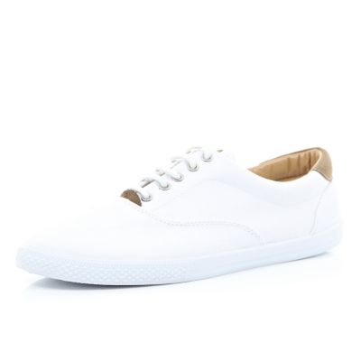 White and tan contrast plimsolls