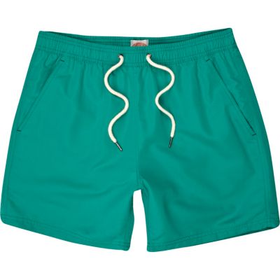 Bright green swim shorts