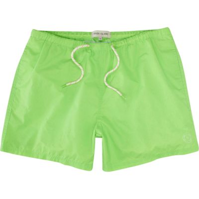 Neon green swim shorts