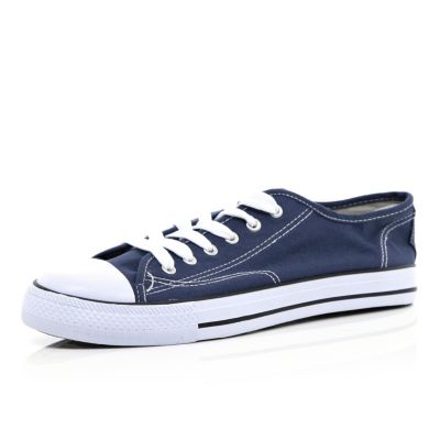 Blue lace up plimsolls
