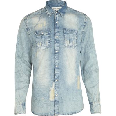 Blue light wash distressed denim shirt