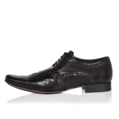Black leather pointed brogues