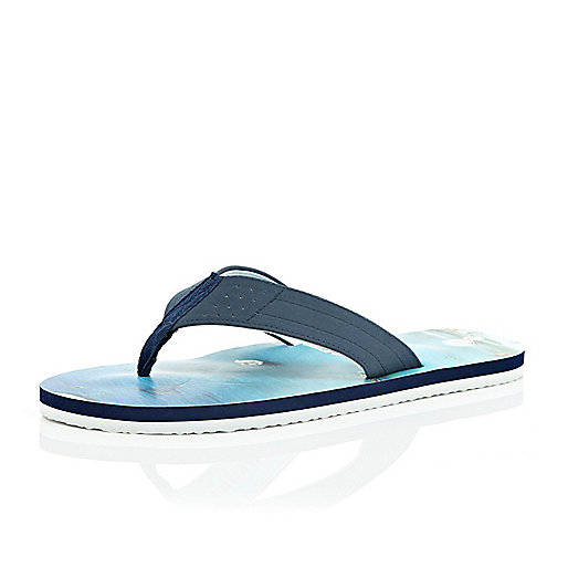 ... on holiday, these plain blue flip flops are your suitcase essential