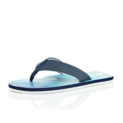 ... on holiday, these plain blue flip flops are your suitcase essential