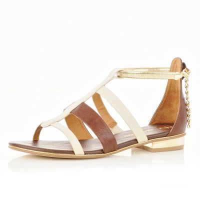 white and brown stappy sandals