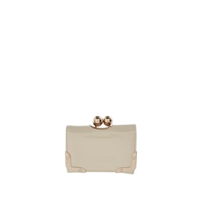 cream embossed clip top purse