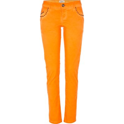 bright orange stud skinny jeans