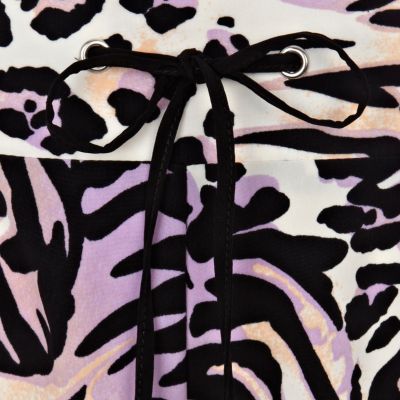 Purple leopard print trousers