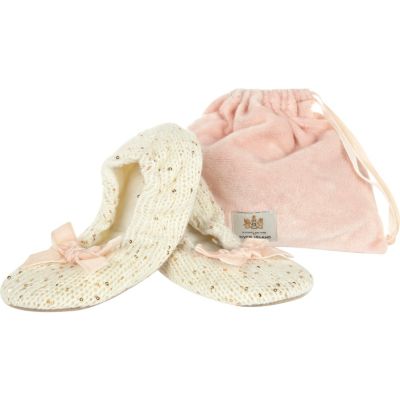 Cream sequin slippers in a bag