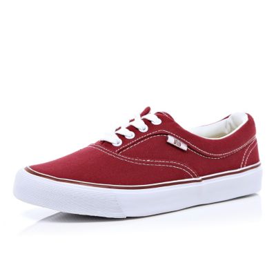 Dark red plimsolls
