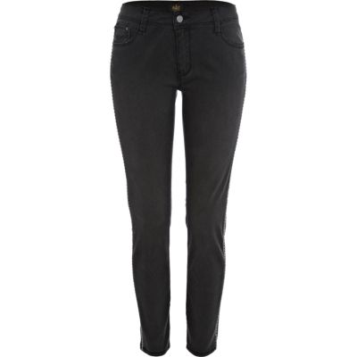 Black side stud skinny trousers