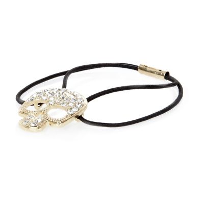 Gold tone diamante skull hair band