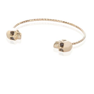 Gold tone skull cuff