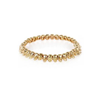 Gold tone skull stretch bracelet