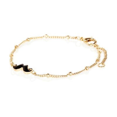 Gold tone moustache chain bracelet