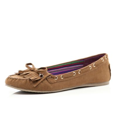 Light brown fringed moccasin shoes