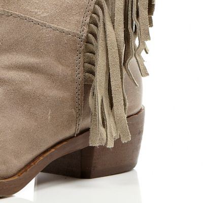 Beige fringed side knee high boots
