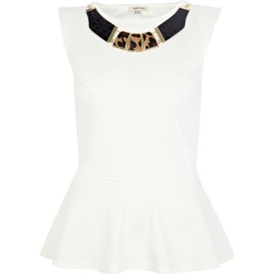 White textured necklace peplum top