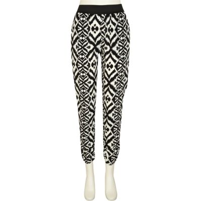 Black and white tribal print tapered trousers