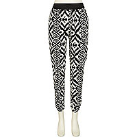 Black and white tribal print tapered trousers