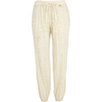 Cream Pacha embellished trousers