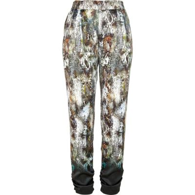 Green snake print dip dye tapered trousers