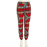 Red aztec print tapered trousers 