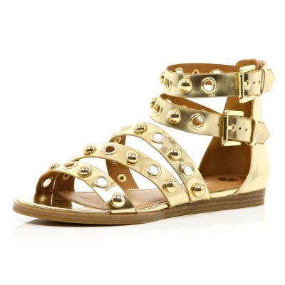 Gold studded eyelet gladiator sandals