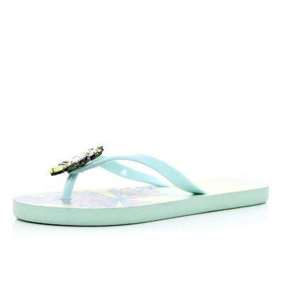 Light green jewel embellished flip flops