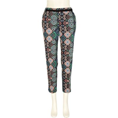Orange Aztec print trousers