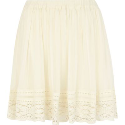 Cream lace trim mini skirt