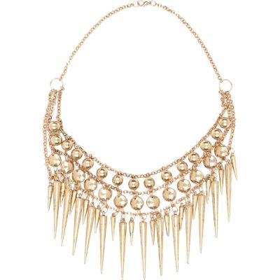 Gold tone spike necklace