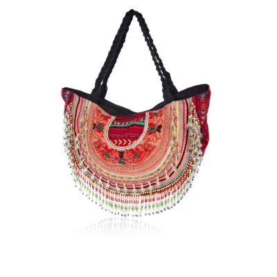 Red embellished curved beach bag