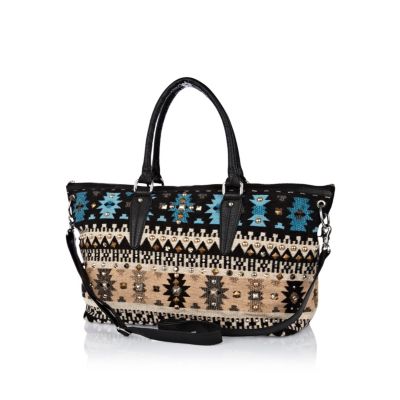 Blue woven studded holdall