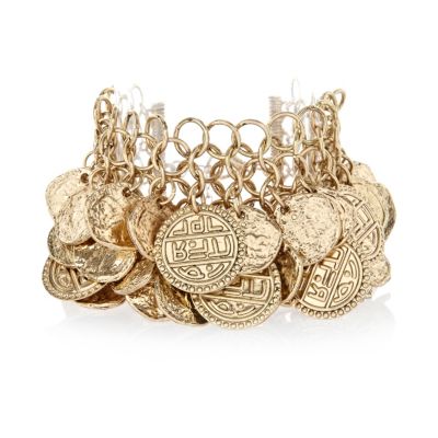 Gold tone layered coin statement bracelet